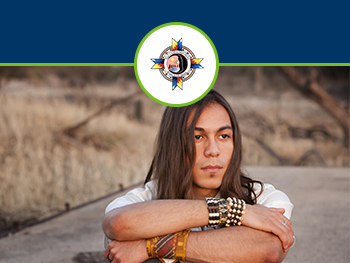 American Indian person with crossed arms 