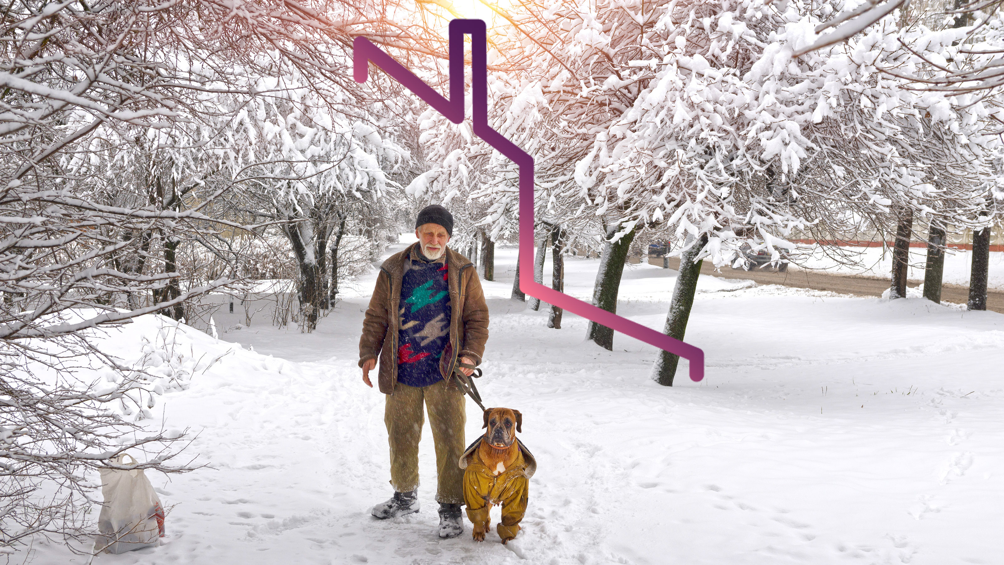 man walking dog in snow