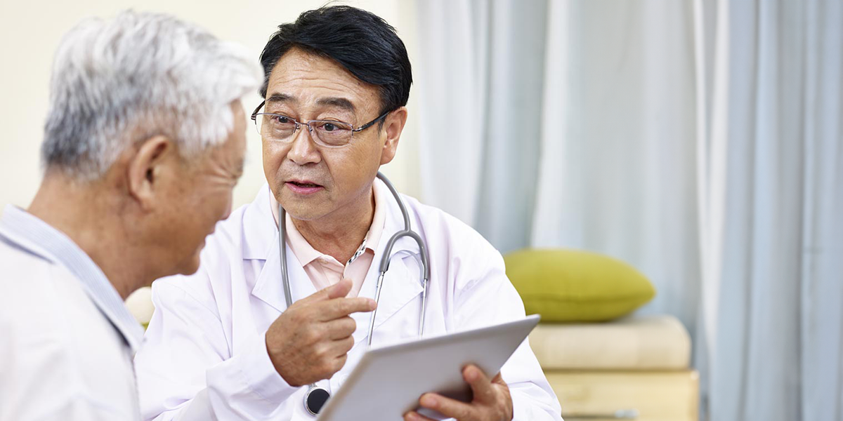 Mother and child talking with doctor in his office