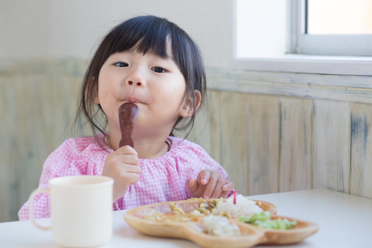 image: Image of child eating