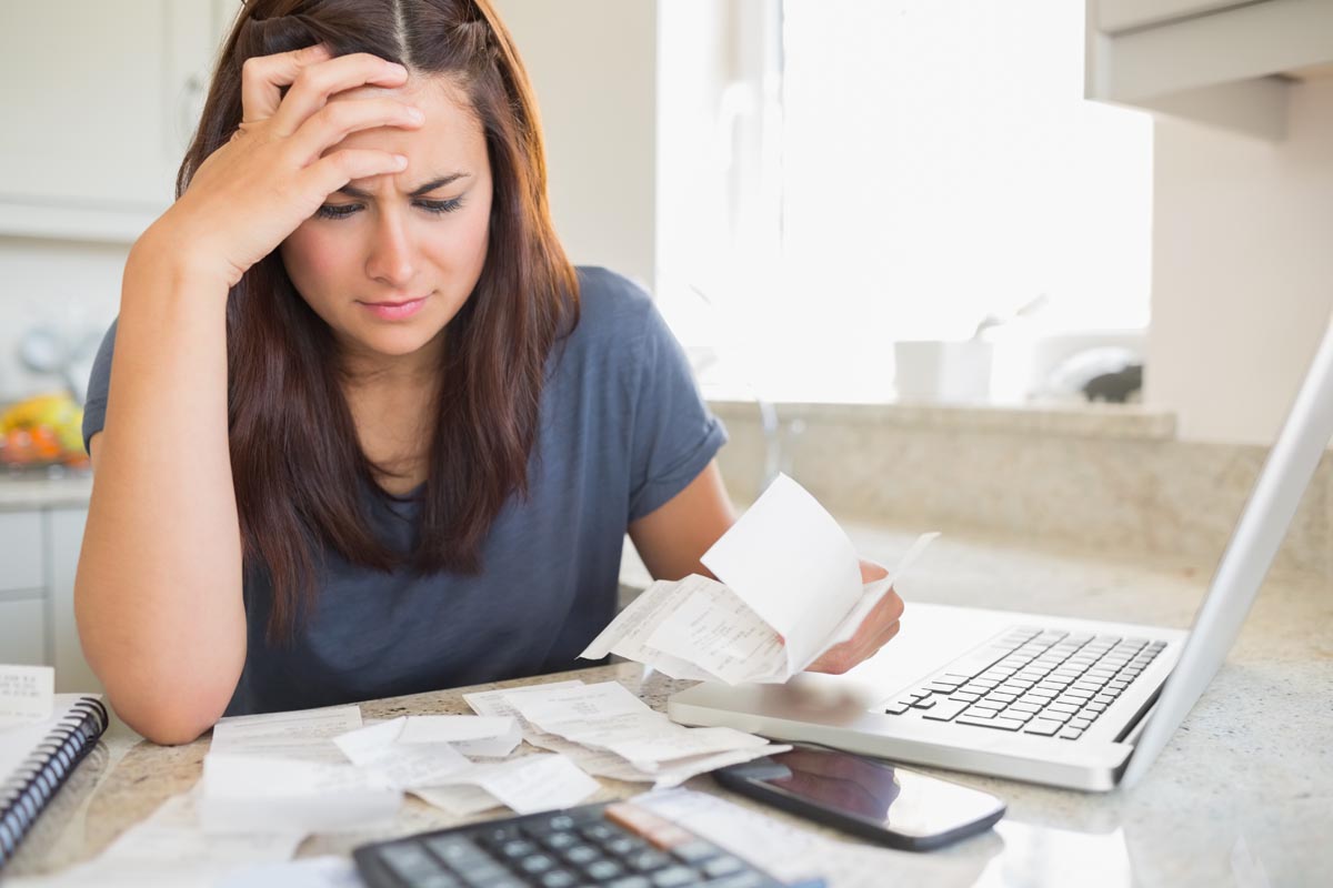 Women frustrated looking at bills