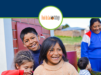 Women and five young children smiling at farm