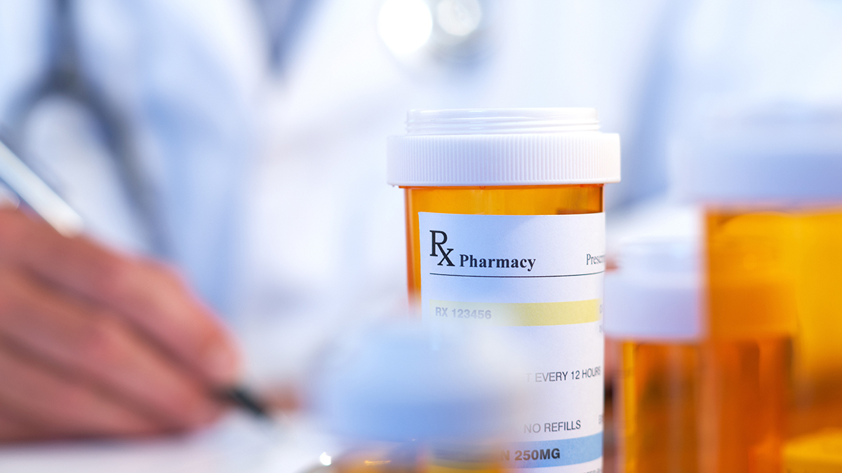 Rx bottle with a hand writing Rx bottle with a hand writing